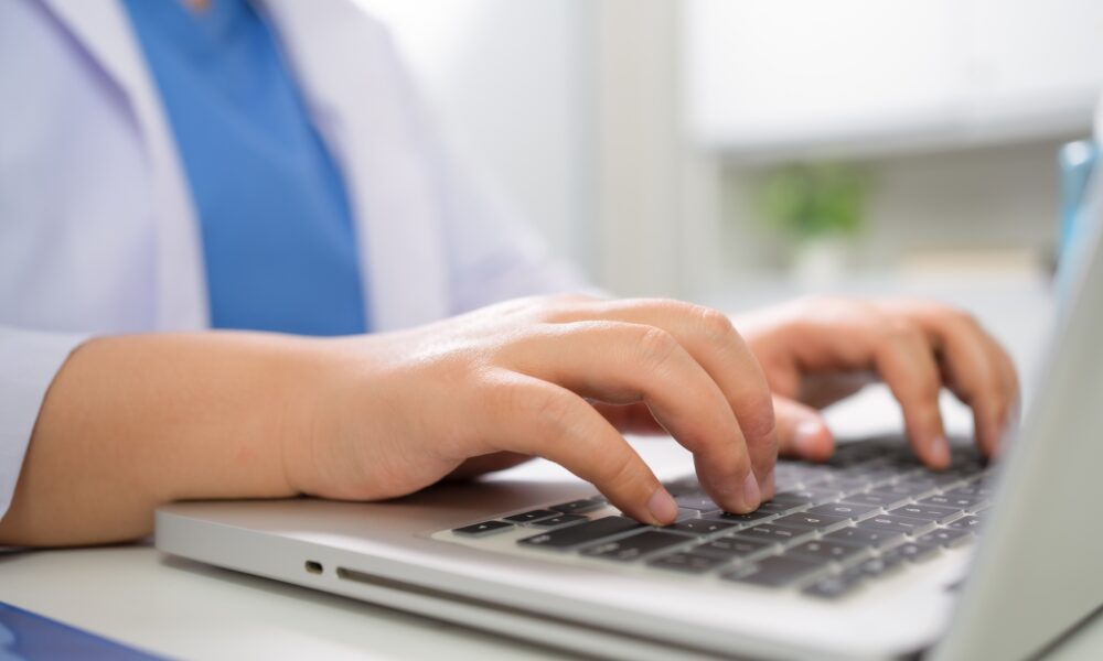 Education profession doctor in white uniform gown coat. Professional medical doctor with tablet and papers at seminar or hospital Coronavirus cancer healthcare.
